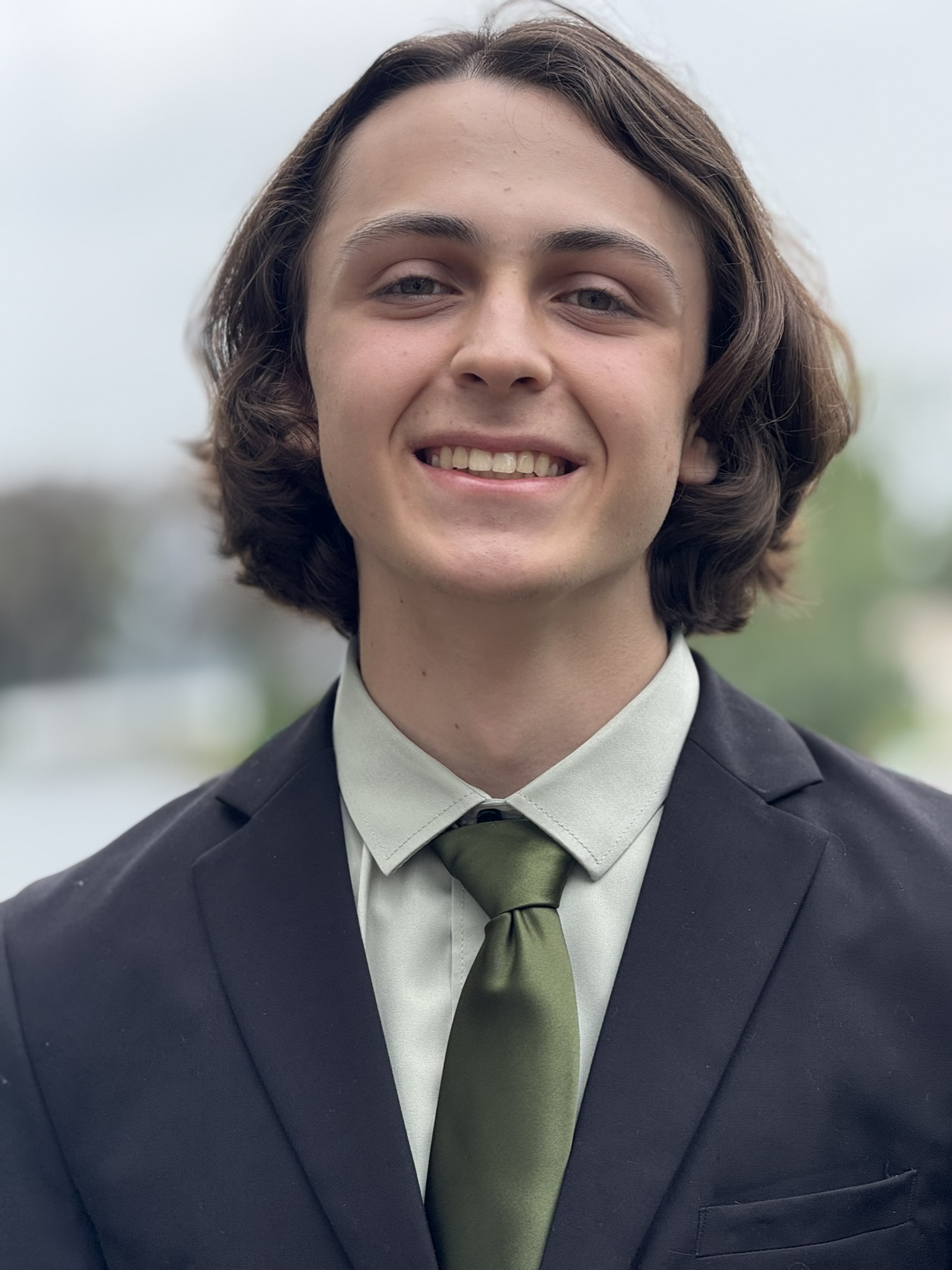 A headshot of JT Plona